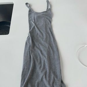 Cotton, ribbed fitted dress with split on the side. Size small.